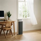 asset_12ee3942de7da614 Winix D480 air purifier beside a desk in a home office with an open window nearby