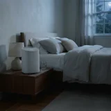 asset_1b71586f1a144b5b Winix A231 air purifier running quietly beside a bed at night