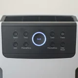 Close view of the Winix 5300-2 control panel showing a blue air quality indicator ring during auto mode