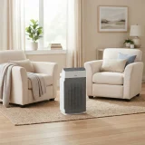Winix 5520 air purifier placed between two armchairs in a bright family living room
