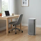 Winix air purifier on a home office floor next to a desk
