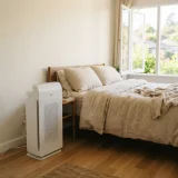 asset_7b9243715a0e898f Winix C610 air purifier running beside a bed during allergy season in a bedroom