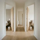 Hallway with doors leading to bedrooms and plain air purifiers in two rooms