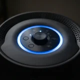 Macro view of the glowing air quality ring on the top control panel of a Winix A230 air purifier