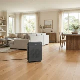 Winix 5500-2 air purifier positioned in the centre of an open-plan living room