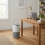 asset_ba83141ea5572980 Air purifier on the floor beside a desk in a home office