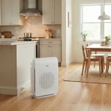 asset_d2796feb752b8ed2 Winix C545 air purifier standing between an open-plan kitchen and dining area