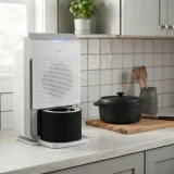 asset_d880b38fdc05aca1 Winix Filter Z canister inside an air purifier on a kitchen counter shortly after cooking
