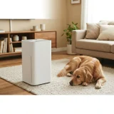 asset_f9ea5eed42892265 Air purifier running in a living room with a dog resting on a rug