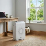 asset_fbd774cca6b69ee9 Winix C545 air purifier beside a desk and a slightly open home office window