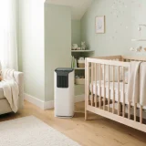 asset_ff5e3f4629cc0114 Winix D480 air purifier in the corner of a bright nursery next to a crib
